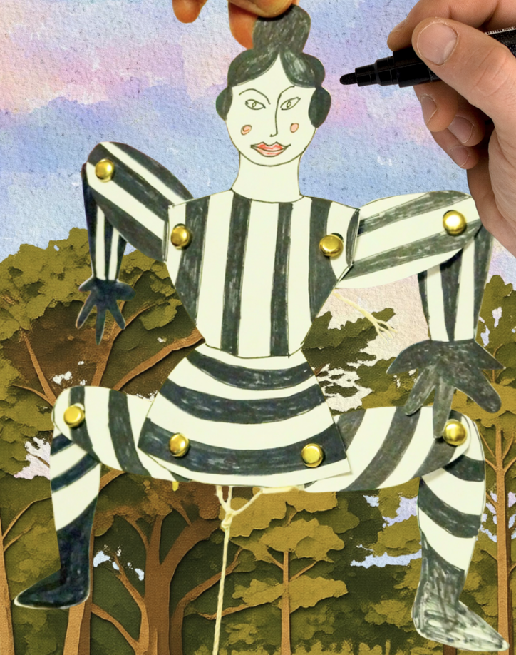 Jumping jack paper hand made puppet with a hand holding a felt tip