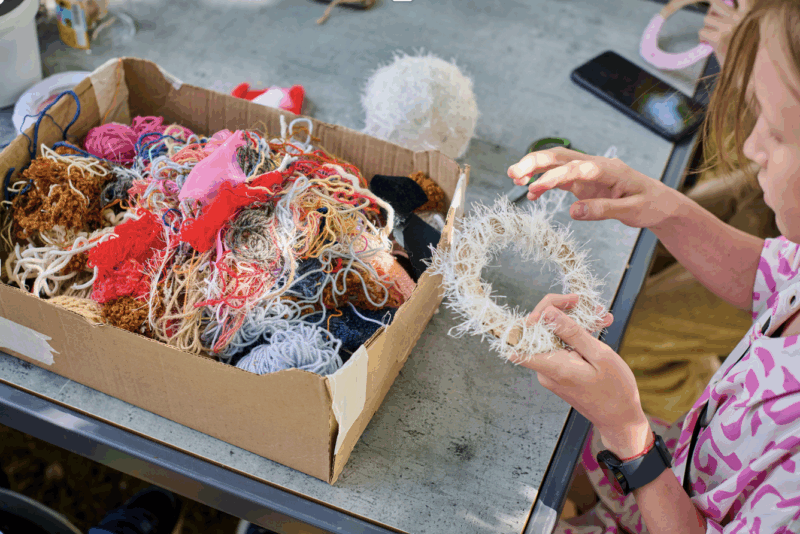 a table of people doing crafts